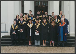 Equine Science Class 2000 in their graduation regalia in front of Plassey House at the University of Limerick