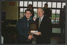 Roger G.H. Downer presenting a student with an award at the opening of the Student Centre at the University of Limerick