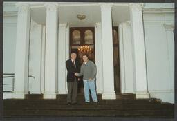 Dr. Roger G.H. Downer with a student in front of Plassey House at the University of Limerick