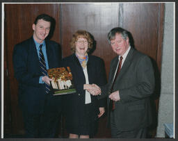 Prof. Donal Dineen and Prof. James Deegan presenting "University of Limerick: A Celebration" to an individual at the University of Limerick