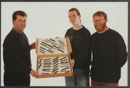 ITD staff Chris Murphy and Brian [Sexton?] displaying a box of electronic chips from "Chips Giveaway" at the University of Limerick